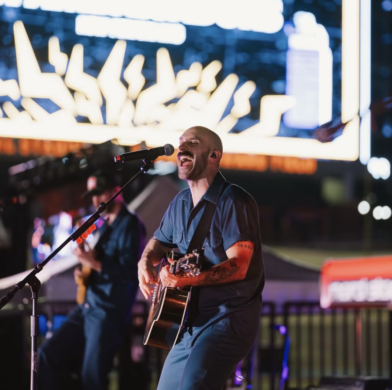 Live acoustic performance under stage lights at Clemson