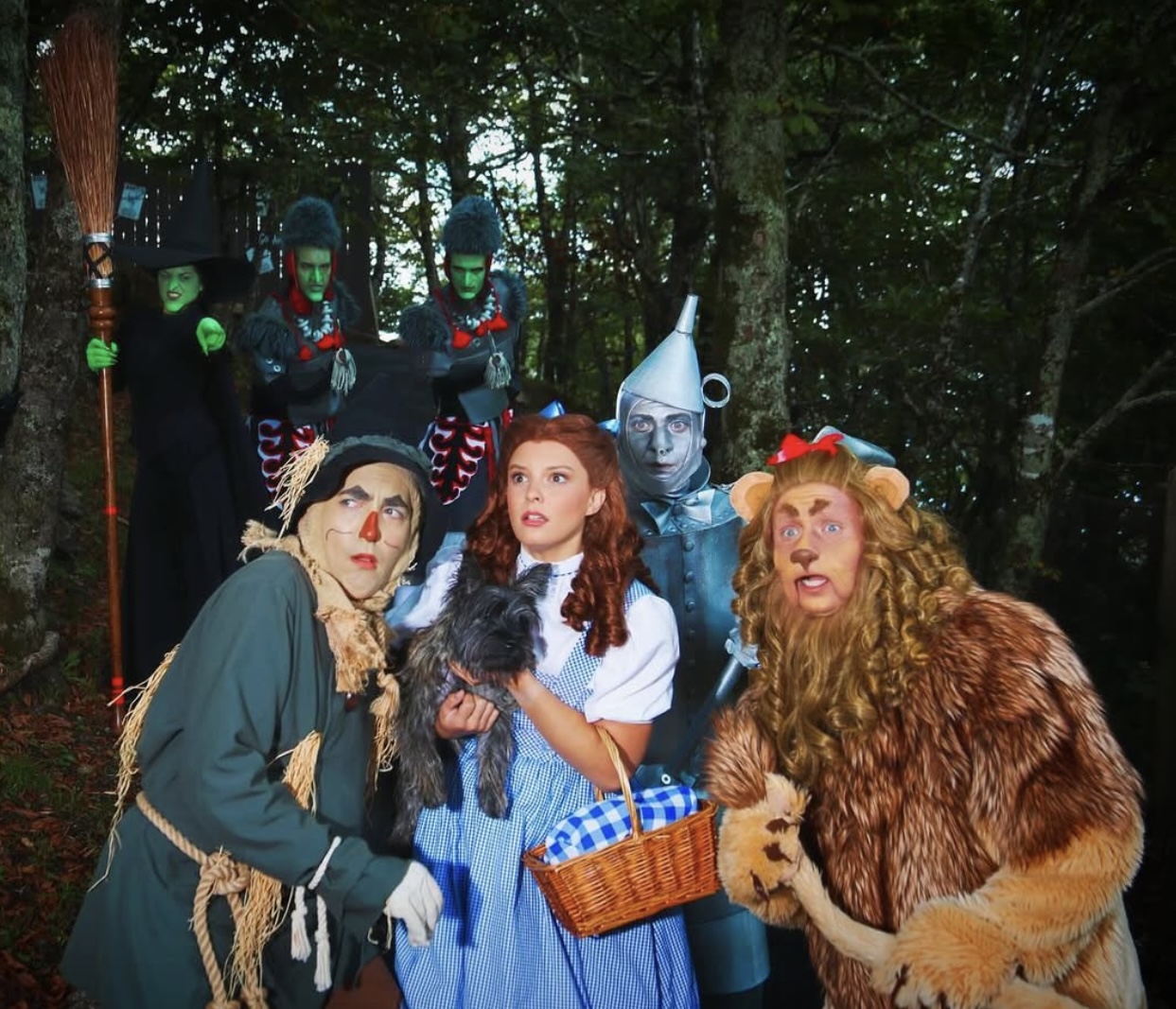Full Land of Oz cast portrait in the woods