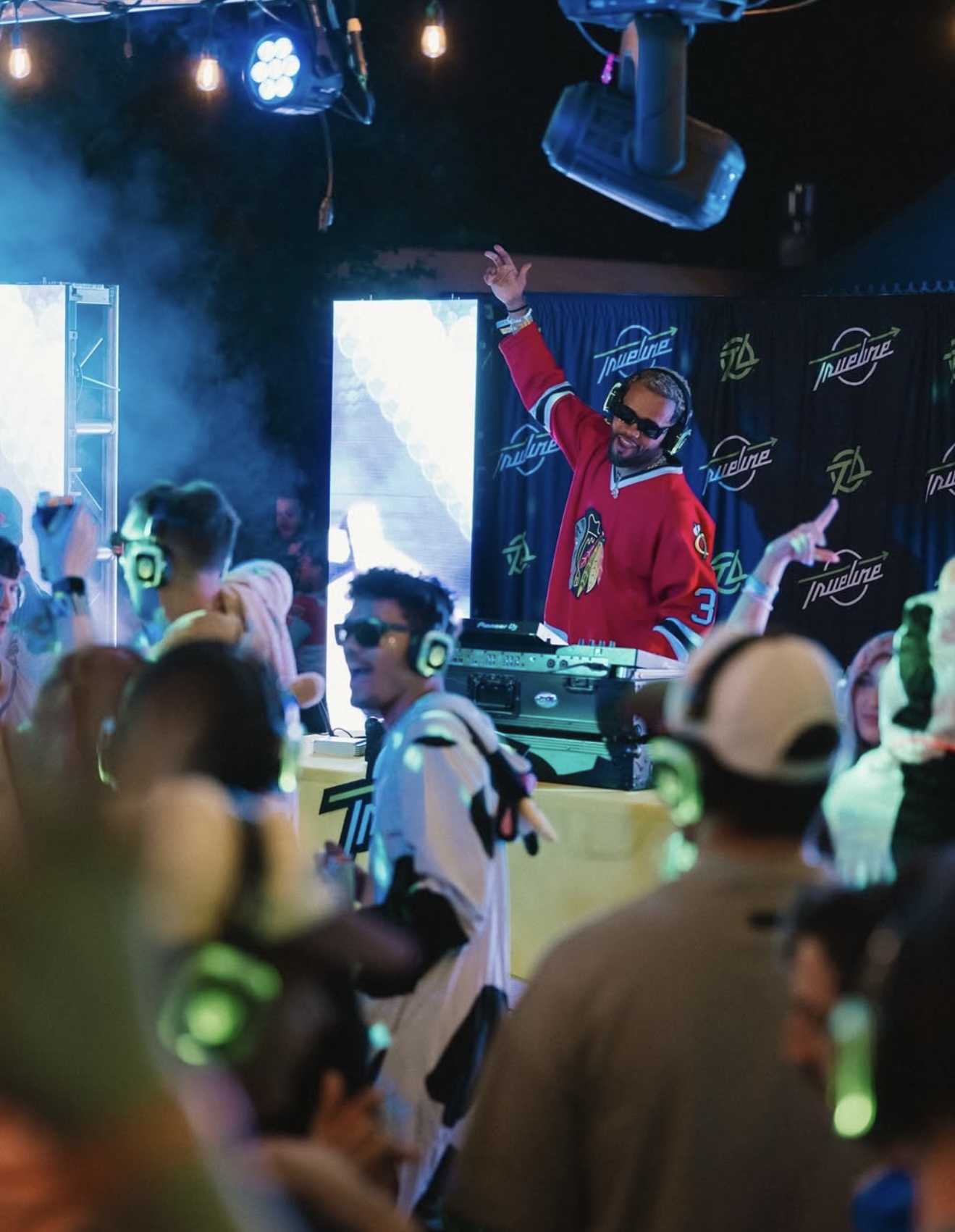 DJ energizing a crowd at a silent disco activation
